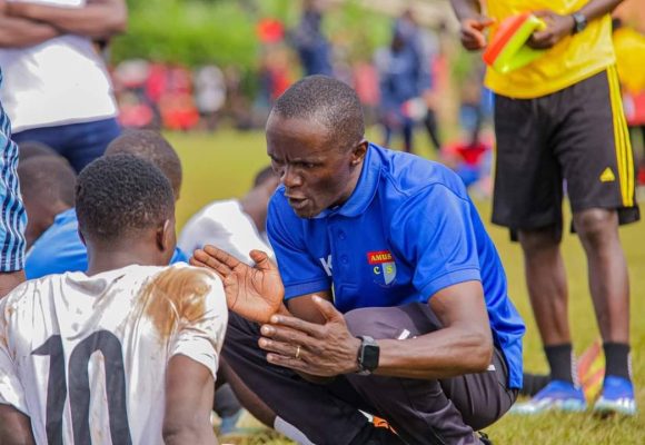 Head Coach Nimrod Kintu aka Mwalimu talking to players at Half time during Amus College Friendly